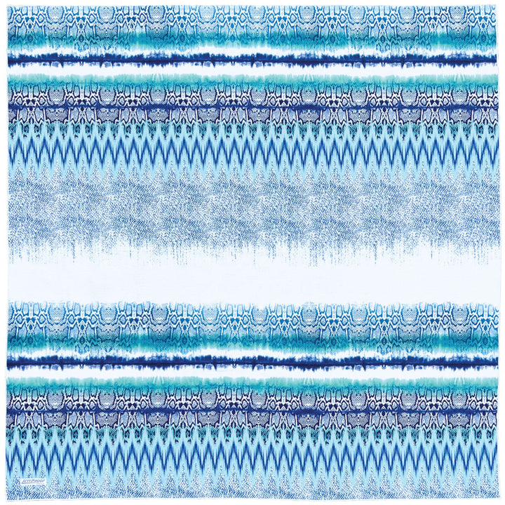 Laid out oversized sand-free towel featuring beautiful unique pattern in shades of blue and turquoise