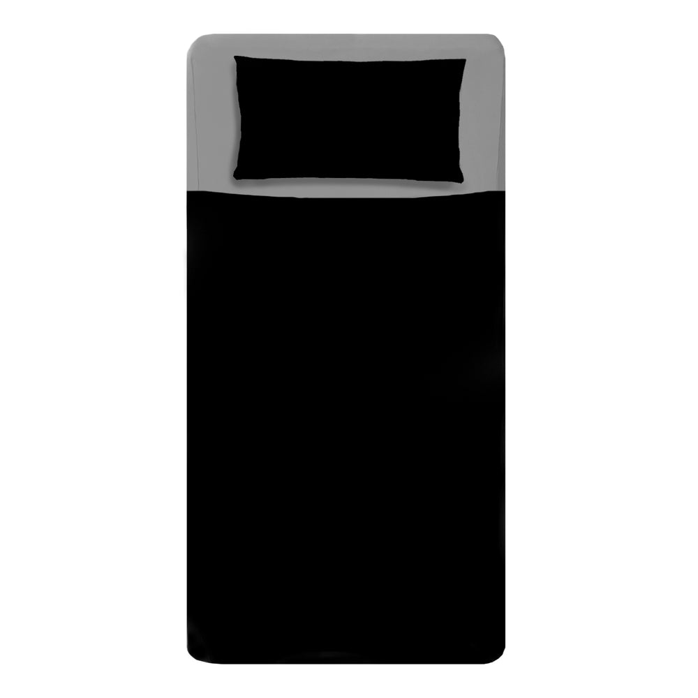 Made bed mattress image with sensory light gray fitted sheets and black compression sheets