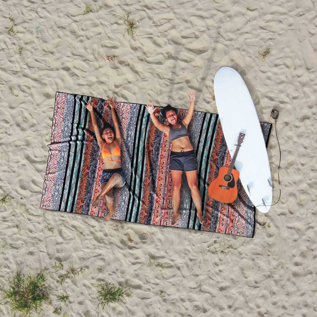 Arial shot of mother and daughter on beautiful morocco patterned sand Free Beach towel