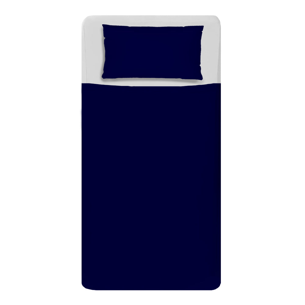Made bed mattress image with sensory white fitted sheets and Navy compression sheets