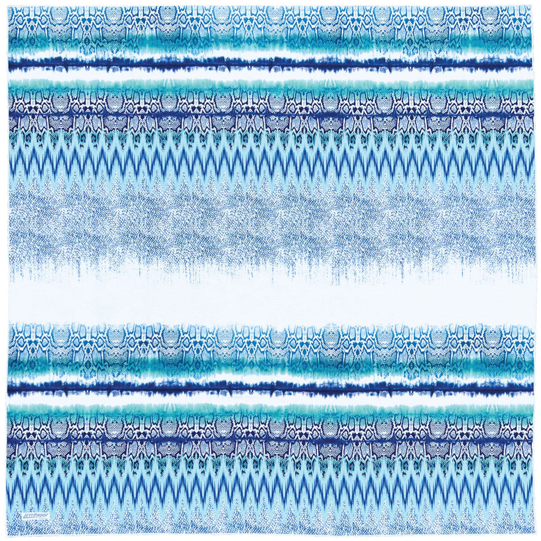 Laid out oversized sand-free towel featuring beautiful unique pattern in shades of blue and turquoise 