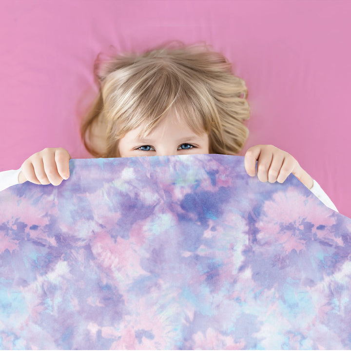 Cute young  gitl on pink sensory fitted sheets with beautiful pastel patterned compression sheet