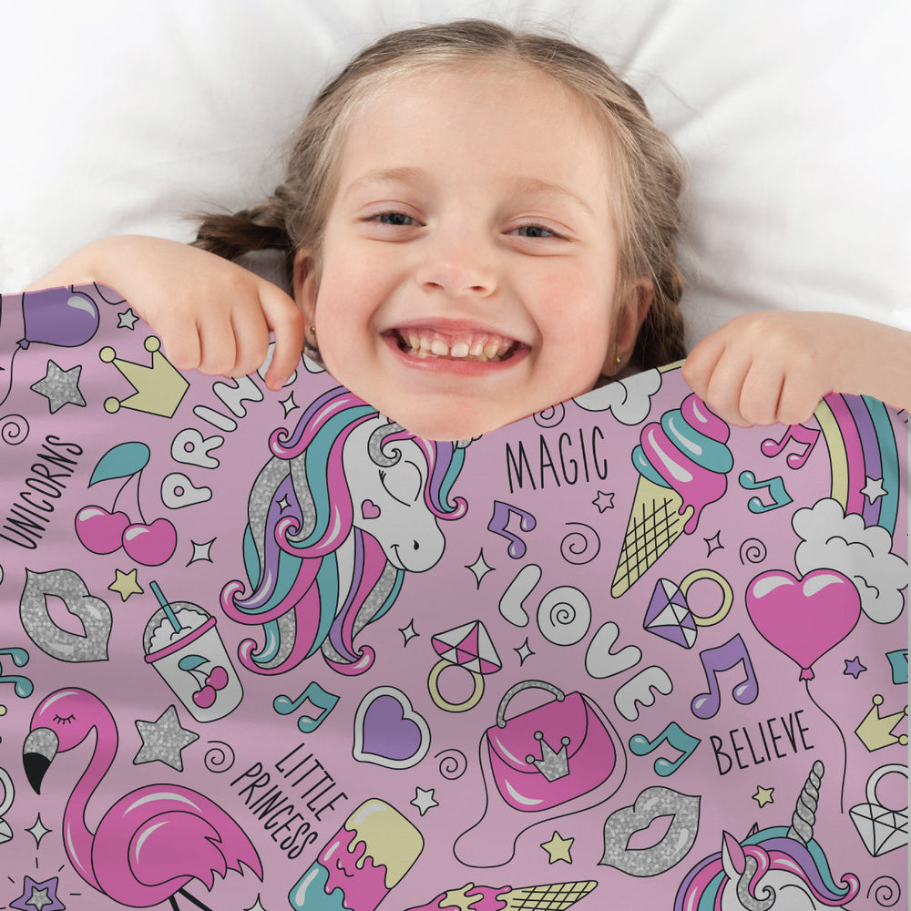 Cute girl with princess pattern sensory compression sheet tucked around chin